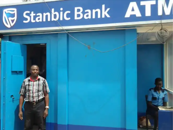 Stanbic Bank off-site ATM kiosk with Mugenyi Moses, AKCP dealer for Uganda.