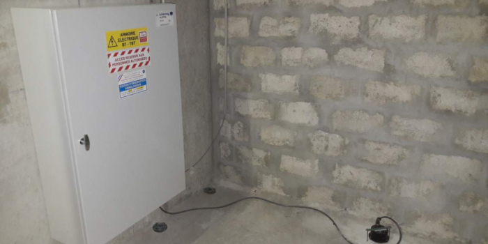 completed cabinet with a seismic sensor embedded in the floor of the basement.